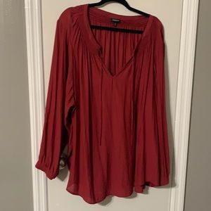 Red float tunic with v shaped tie neck